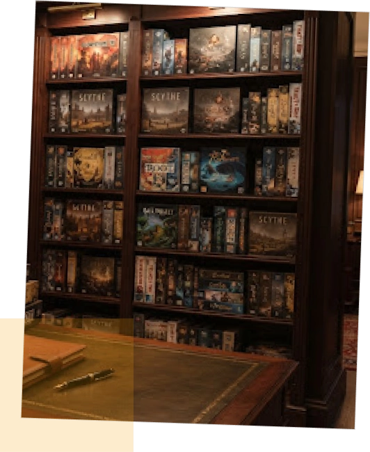 A large wooden library bookshelf filled with various popular board games like Scythe and Root